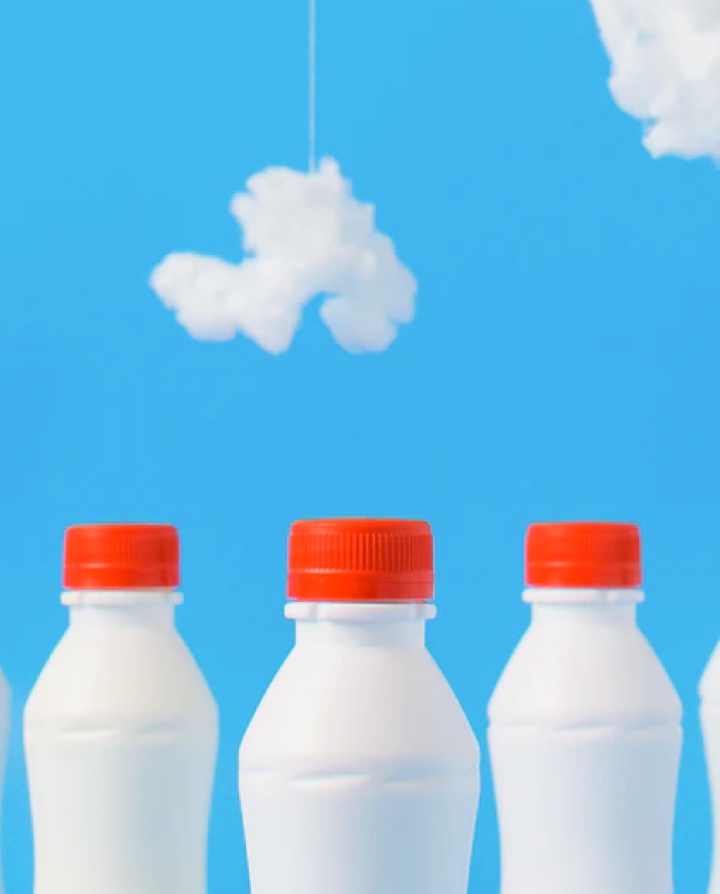 white milk bottle on blue background